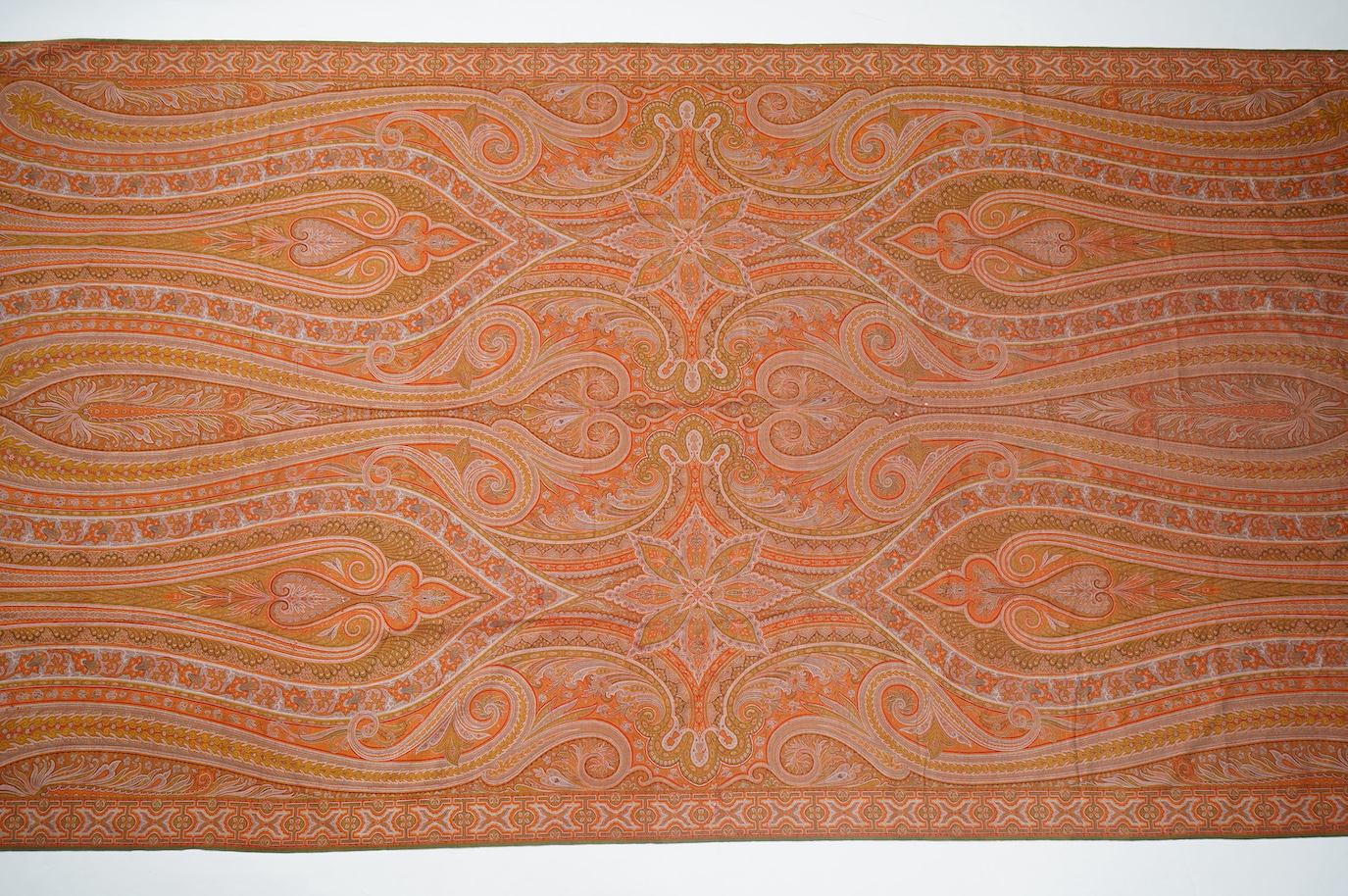 A French possibly Lyon, 19th century ornate silk and fine wool woven Paisley patterned shawl. Woven in polychromes coloured silks and wools on a jacquard loom, using an array of punch cards to create this elaborate desig